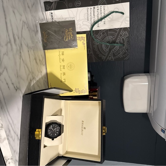 Audemars Piguet Elegant Black and Gold Timepiece